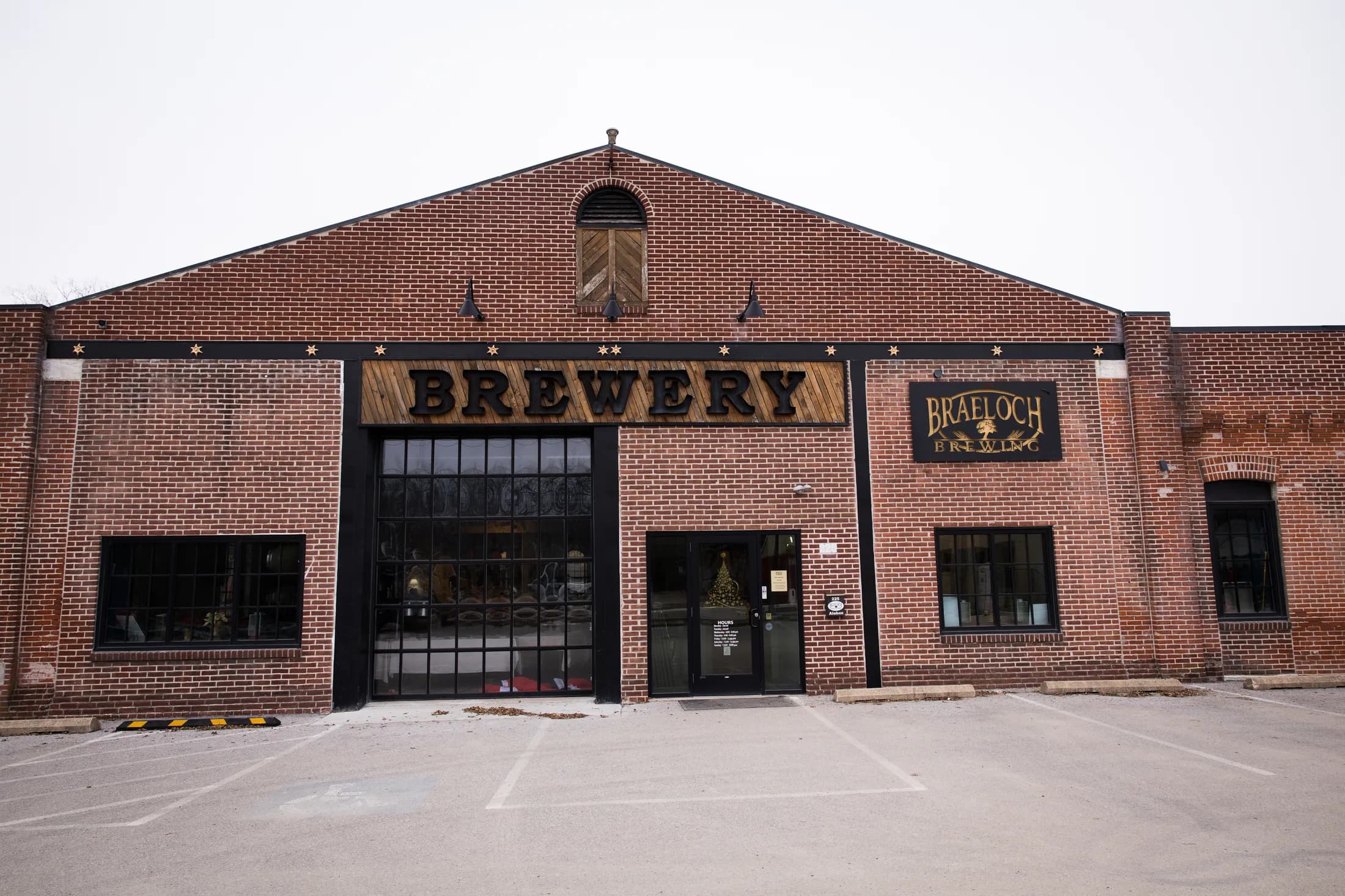 The 1903 trolley barn that houses Braeloch, BREWERY sign over the old trolley door